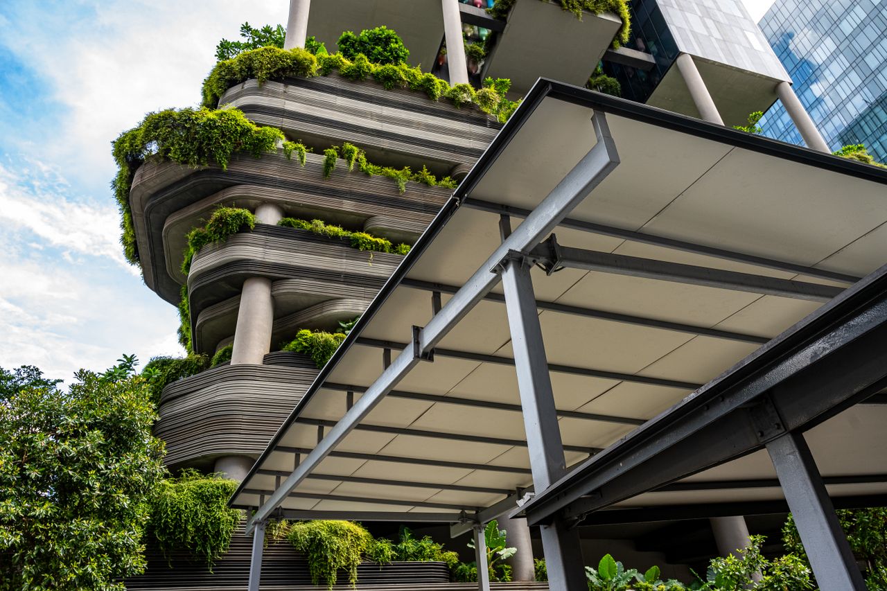 Stunning modern architecture in Singapore with lush greenery integrated into the building design.